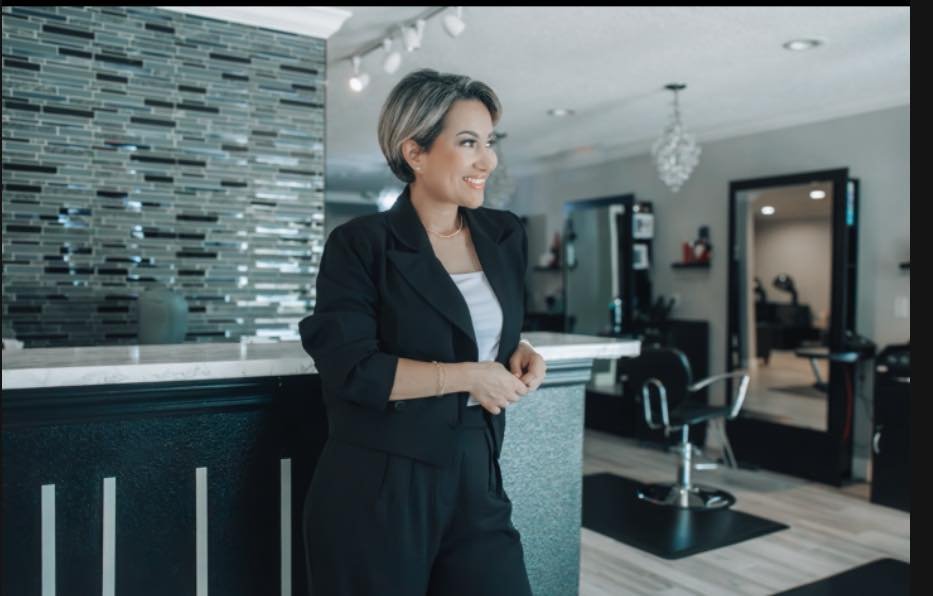 Stylist performing precision haircut